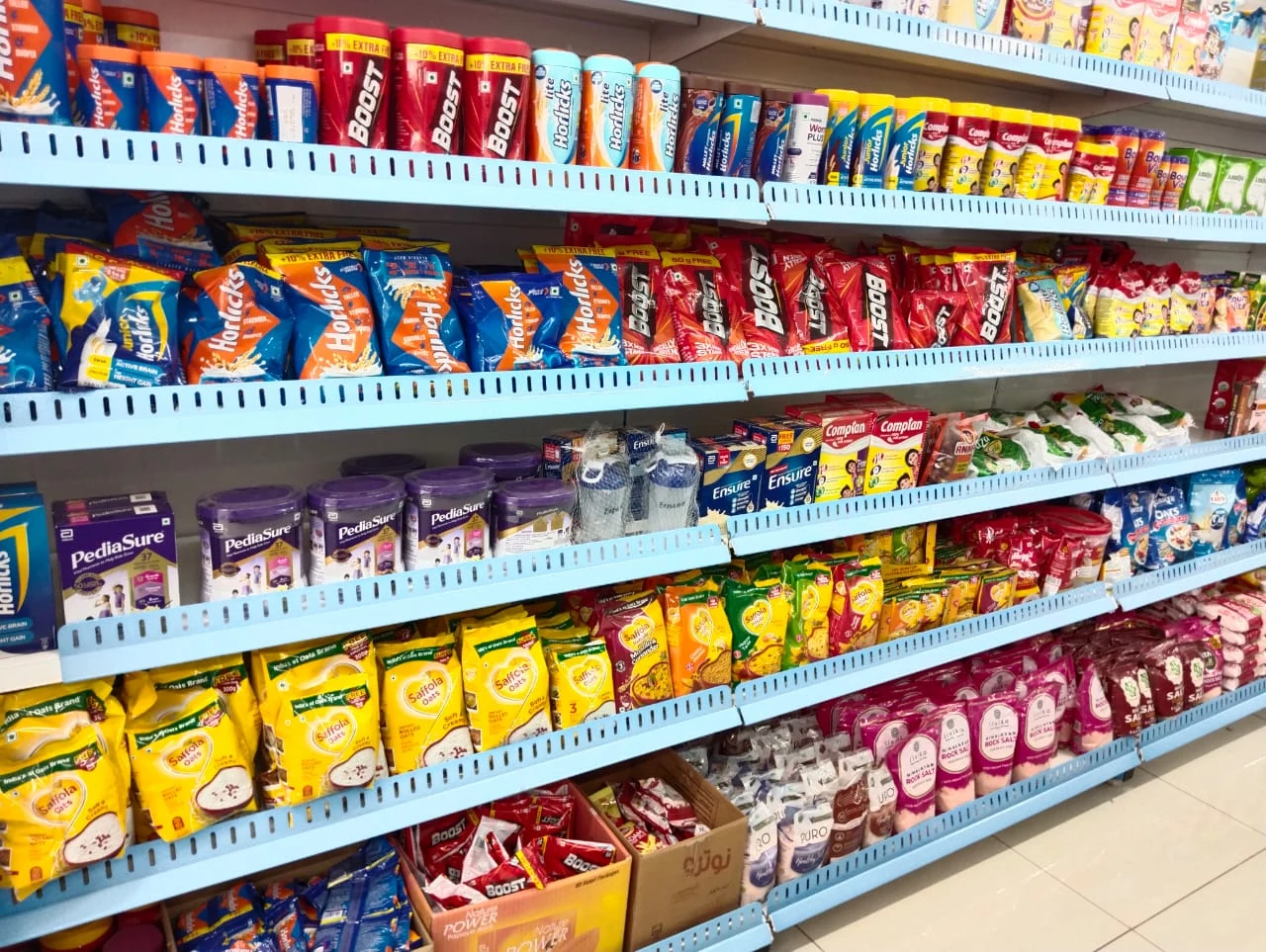 Well-stocked shelves inside Aadhavan Super Market